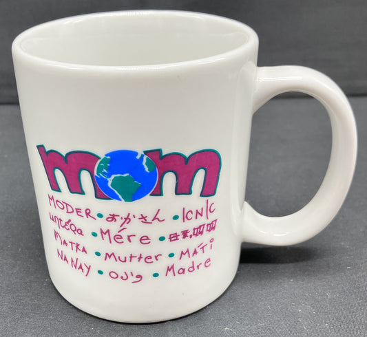 "Mom" mug with Mom printed in 12 additional languages, the "O" in Mom is a globe