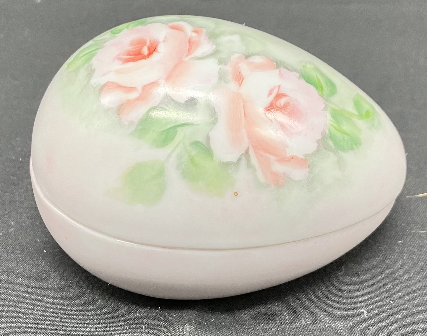 Egg shaped 2 piece ceramic trinket dish. White with pink floral decoration