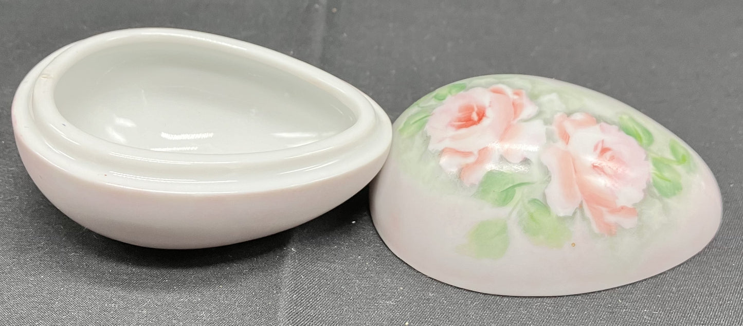 Egg shaped 2 piece ceramic trinket dish. White with pink floral decoration